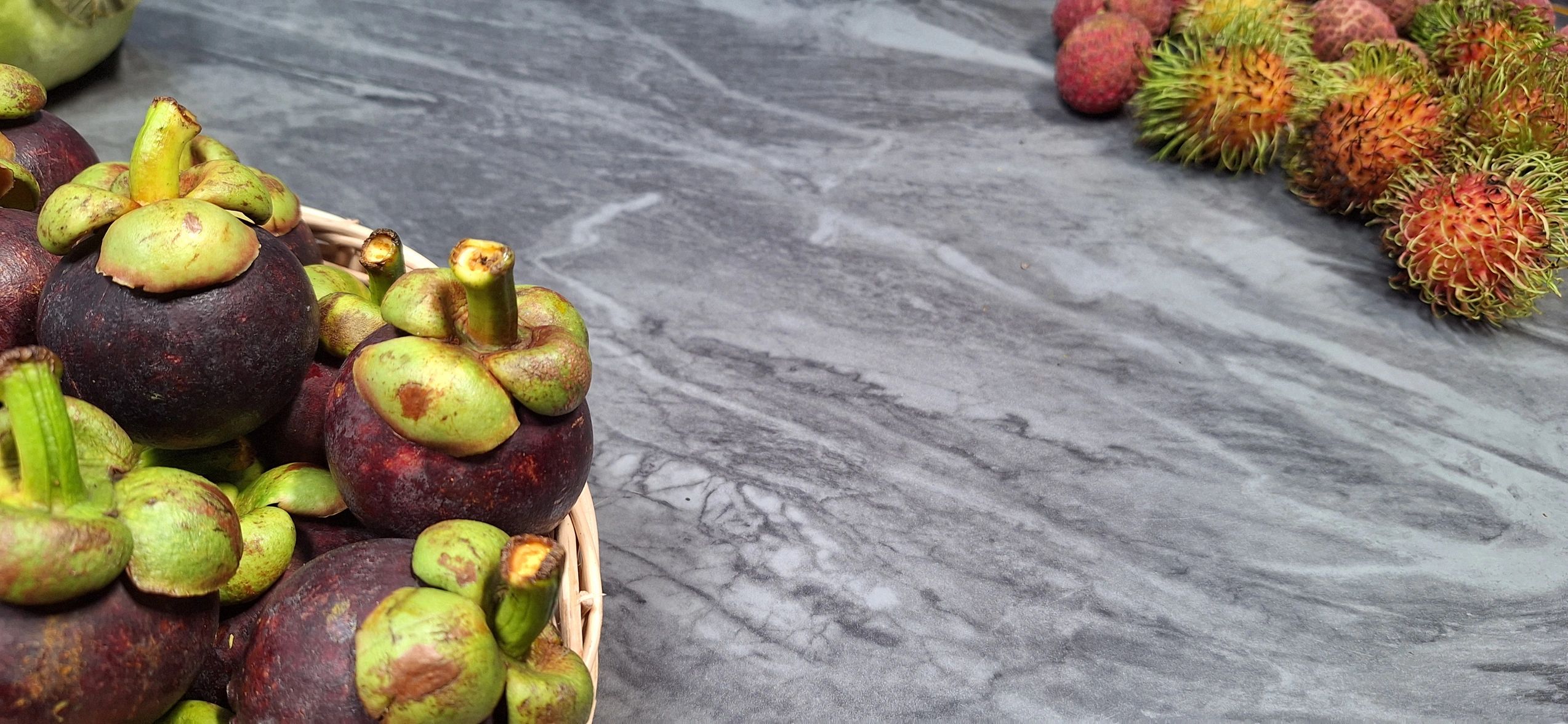 Fresh tropical fruits arranged on a table