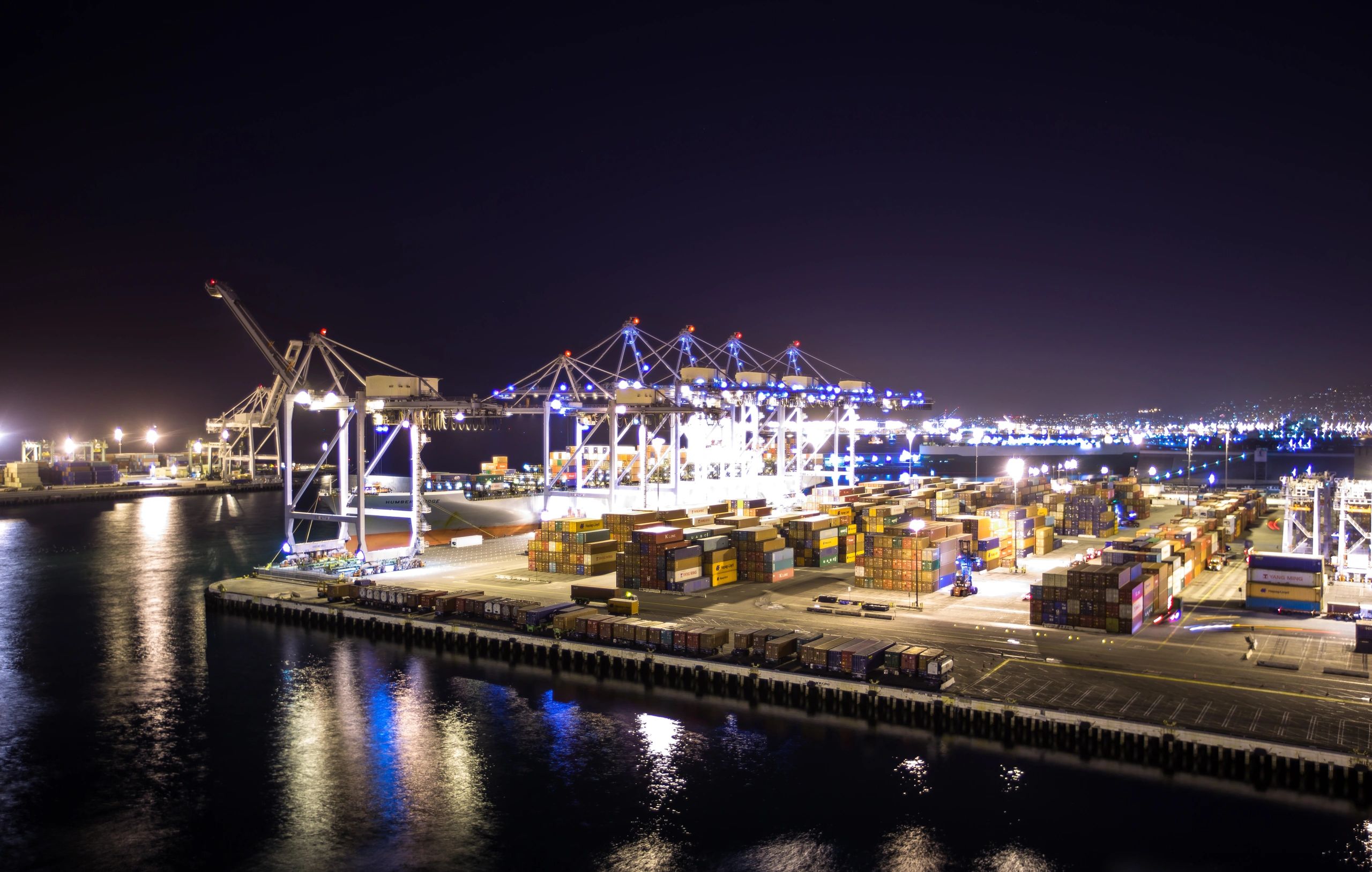 Container port logistics at sunset